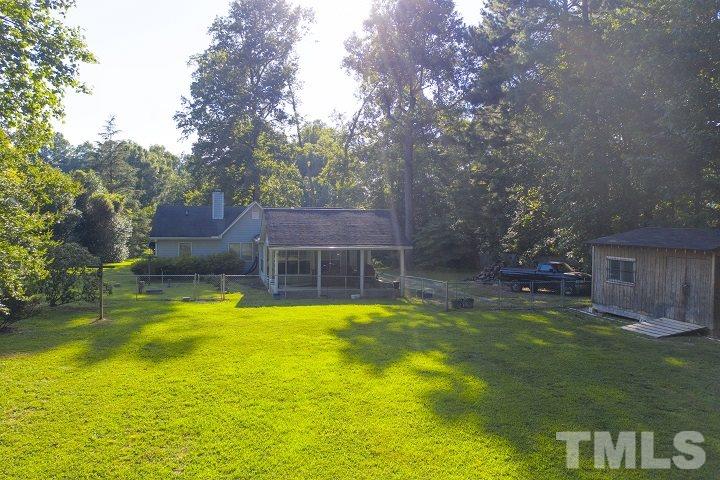 6720 Kiger Road Rougemont, NC 27572 - Photo 6 of 22 a view of a swimming pool with a patio