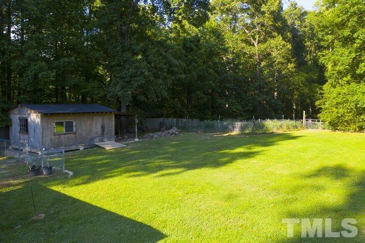 6720 Kiger Road Rougemont, NC 27572 - Photo 8 of 22 a view of a house with a yard