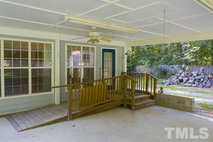 6720 Kiger Road Rougemont, NC 27572 - Photo 10 of 22 a view of a house with a wooden floor and fence