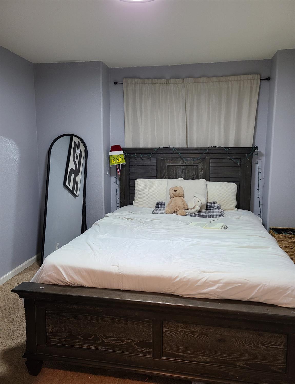 440 East Stanley Avenue Reedley, CA 93654 - Photo 17 of 25 a bedroom with a bed and a table