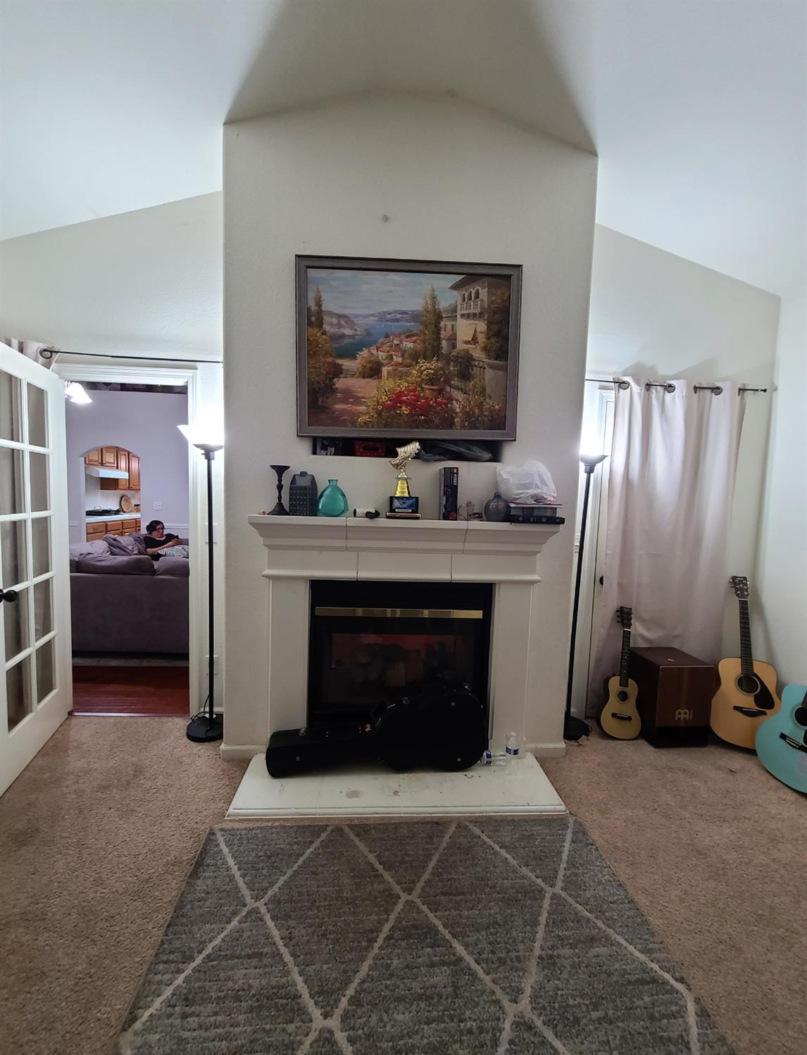 440 East Stanley Avenue Reedley, CA 93654 - Photo 3 of 25 a living room with furniture a flat screen tv and a fireplace