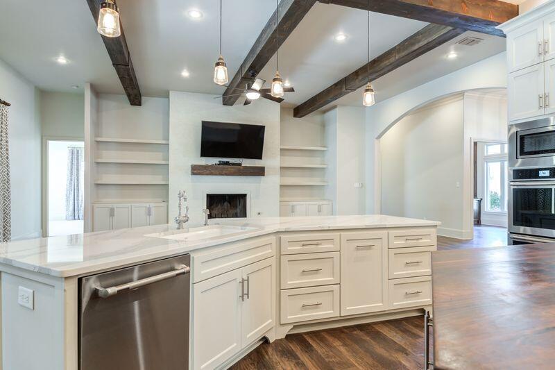 11107 Miami Avenue Lubbock, TX 79423 - Photo 19 of 82 a kitchen with a sink stainless steel appliances and cabinets