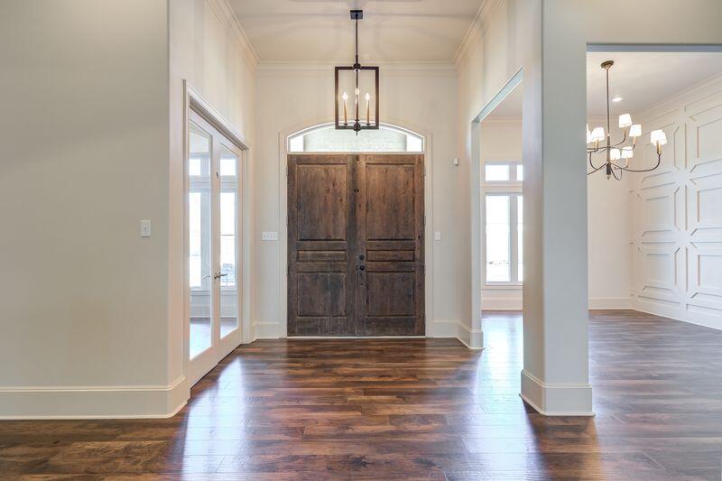 11107 Miami Avenue Lubbock, TX 79423 - Photo 2 of 82 a view of a hallway with wooden floor and cabinet