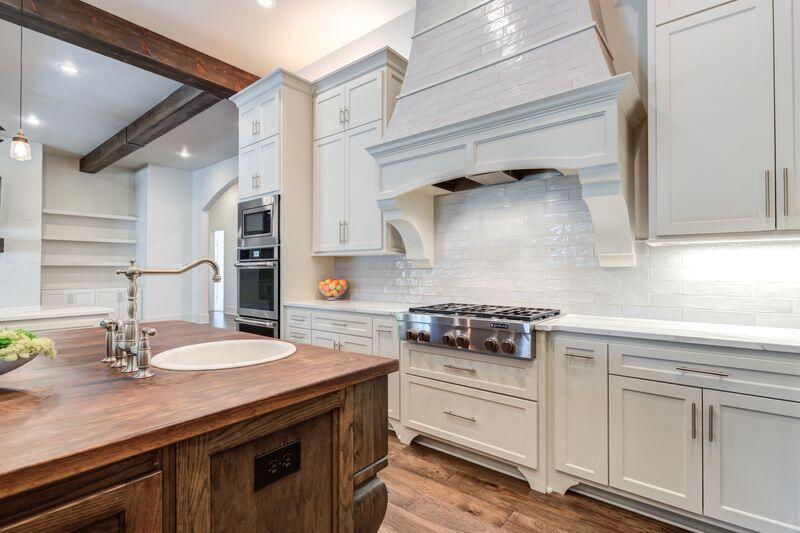 11107 Miami Avenue Lubbock, TX 79423 - Photo 24 of 82 a kitchen with stainless steel appliances granite countertop a sink stove and cabinets