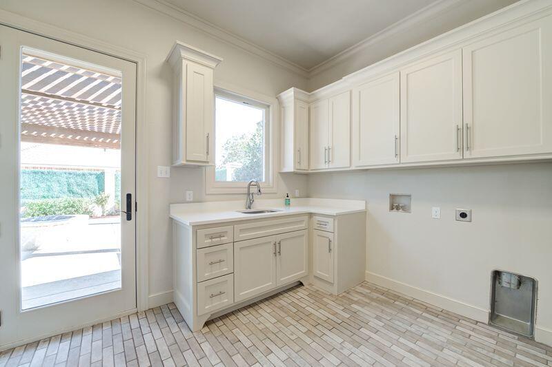 11107 Miami Avenue Lubbock, TX 79423 - Photo 33 of 82 a kitchen with stainless steel appliances granite countertop a sink and wooden cabinets