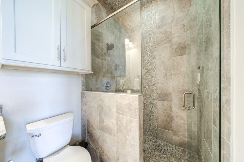 11107 Miami Avenue Lubbock, TX 79423 - Photo 53 of 82 a bathroom with a toilet and a shower