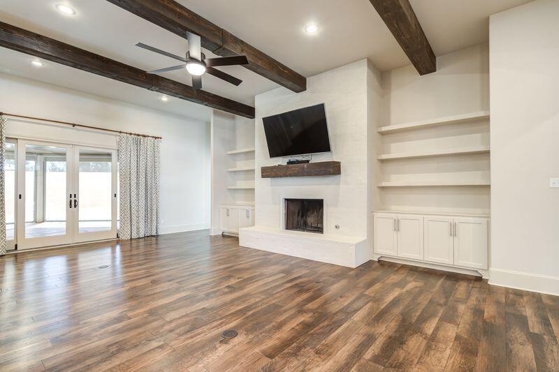 11107 Miami Avenue Lubbock, TX 79423 - Photo 9 of 82 a view of a livingroom with an empty space and a fireplace