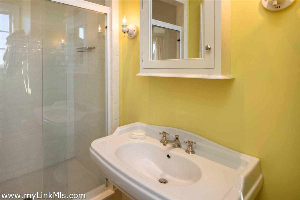 25 Lelands Path Edgartown, MA 02539 - Photo 43 of 56 a bathroom with a sink and a mirror