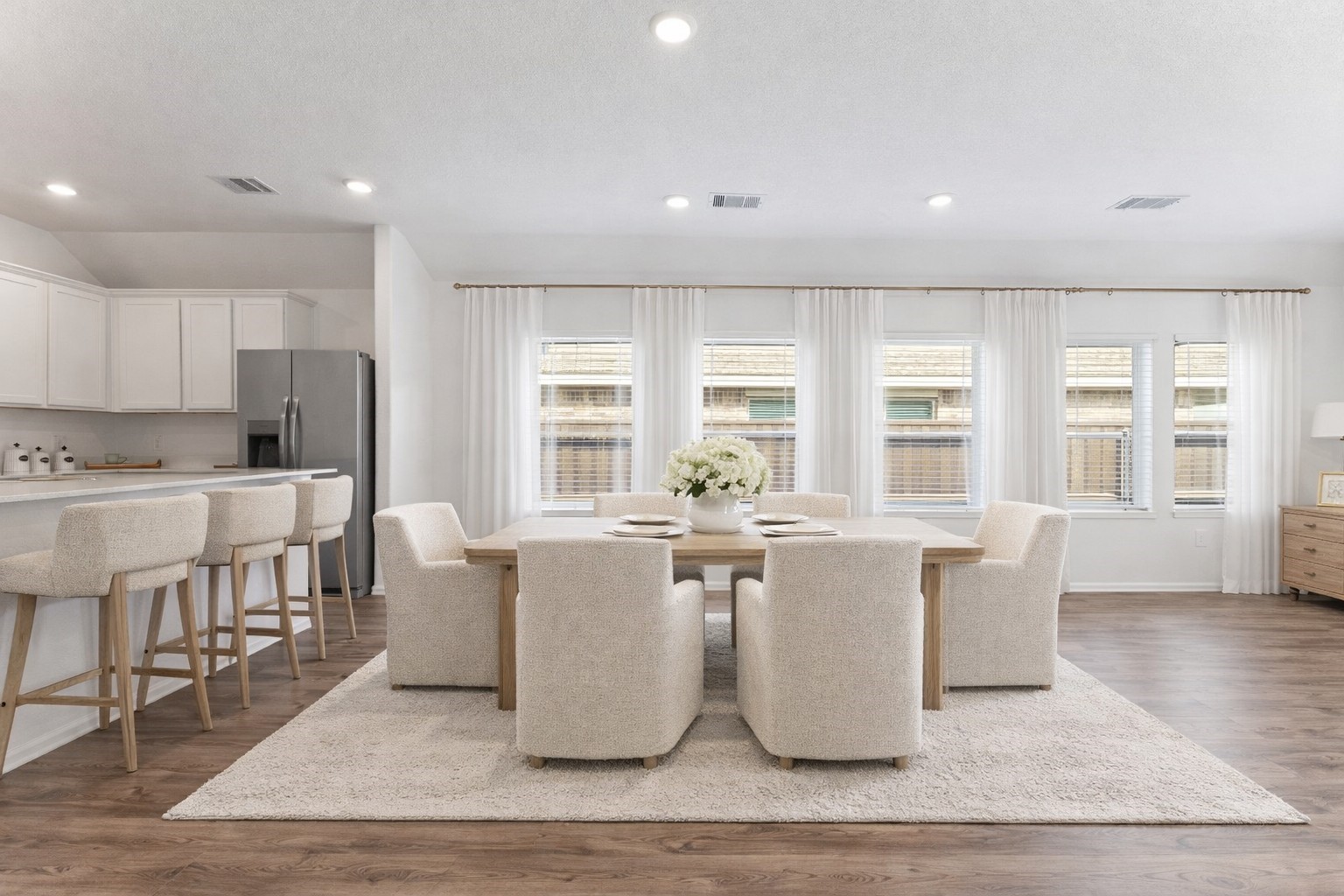 2850 Paradise Ridge Way Conroe, TX 77301 - Photo 8 of 21 This virtually staged dining room offers a bright, inviting space perfect for gatherings, seamlessly blending elegance with modern comfort.