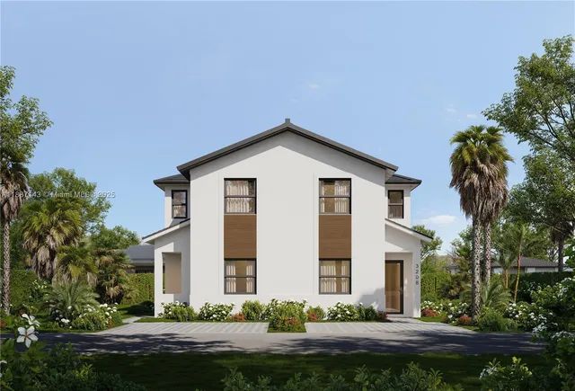 a front view of a house with a garden