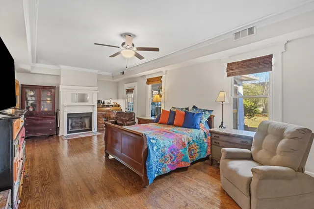 a bed room with furniture and a fireplace