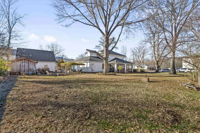a house view with large trees