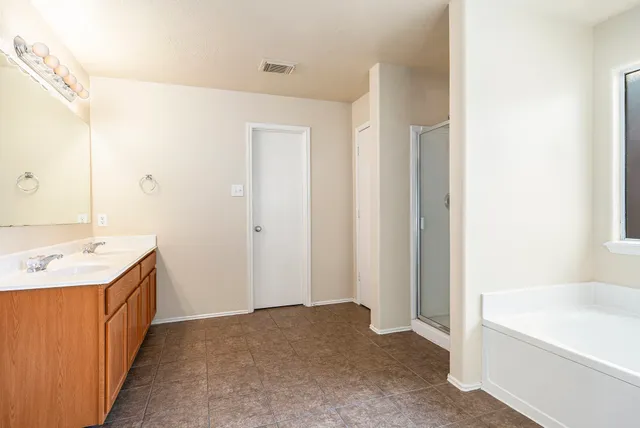 a bathroom with a sink and a bathtub