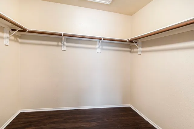 a view of an empty walk in closet