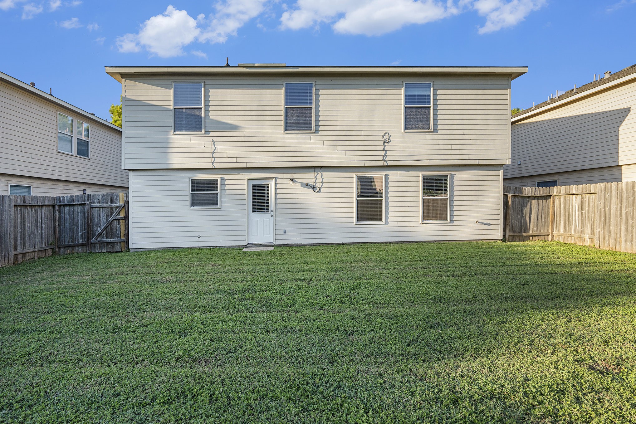 18227 Thicket Grove Road Houston, TX 77084 - Photo 25 of 28 a view of a house with a backyard