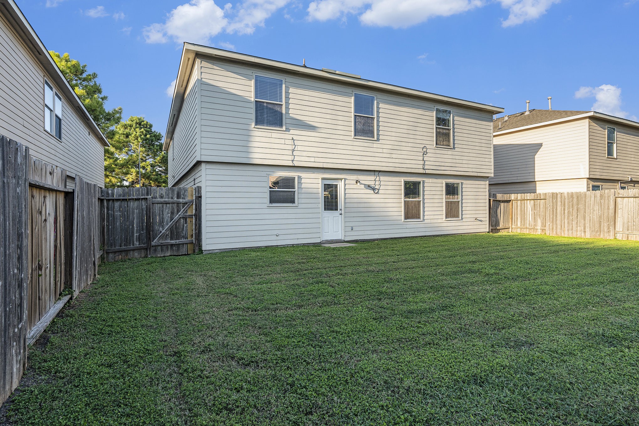 18227 Thicket Grove Road Houston, TX 77084 - Photo 26 of 28 a front view of house with yard and green space