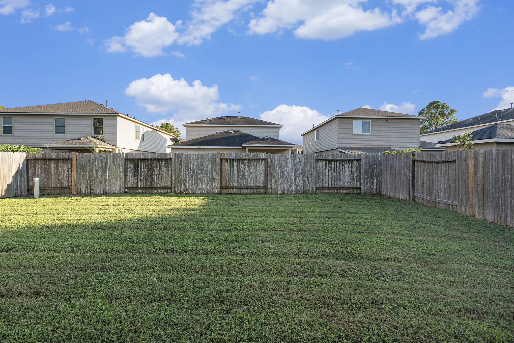 18227 Thicket Grove Road Houston, TX 77084 - Photo 27 of 28 a view of a house with a backyard