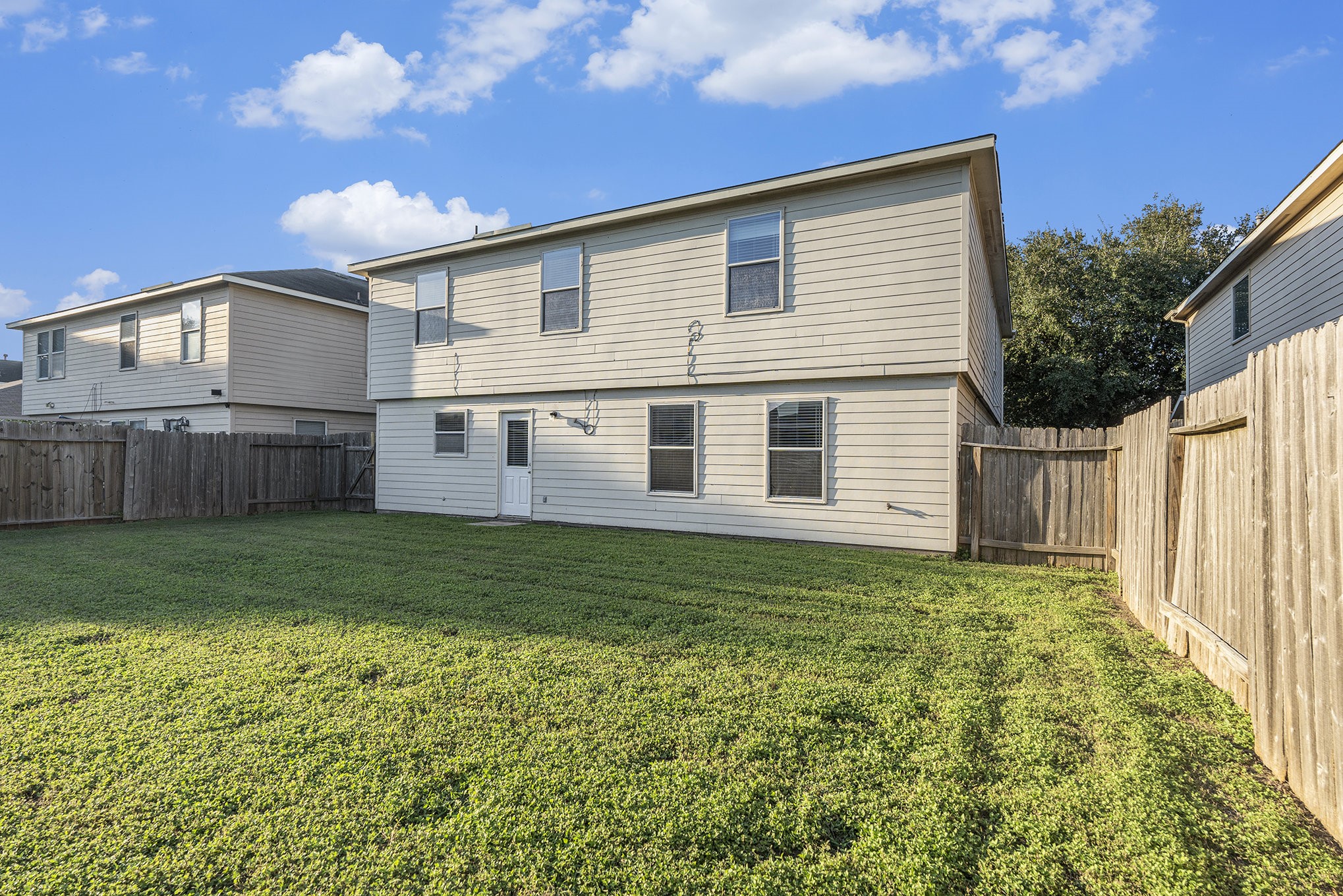 18227 Thicket Grove Road Houston, TX 77084 - Photo 28 of 28 a view of a house with backyard