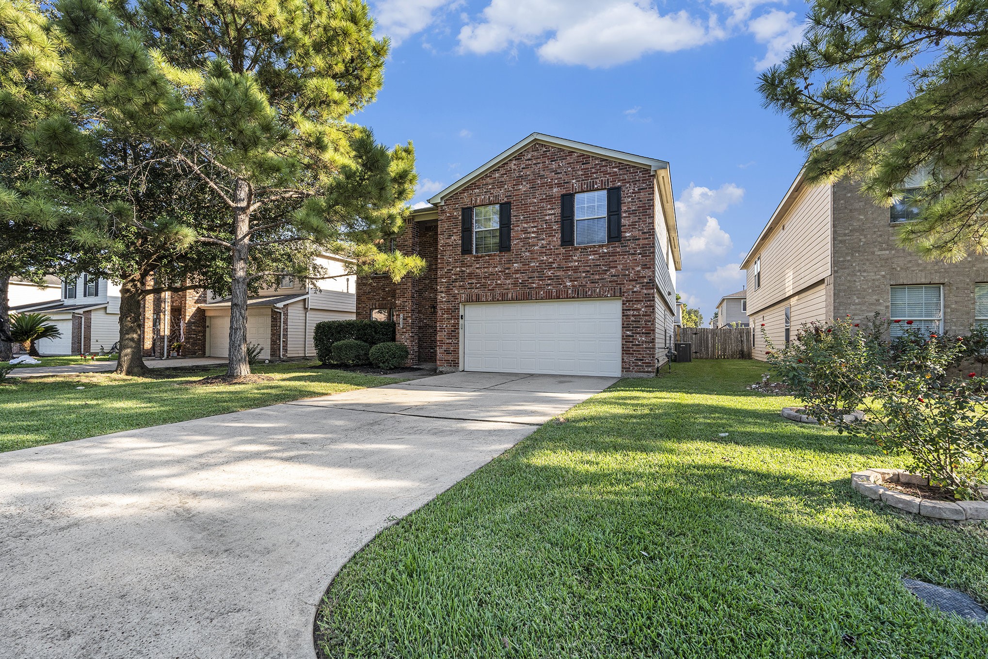 18227 Thicket Grove Road Houston, TX 77084 - Photo 3 of 28 a front view of a house with a yard