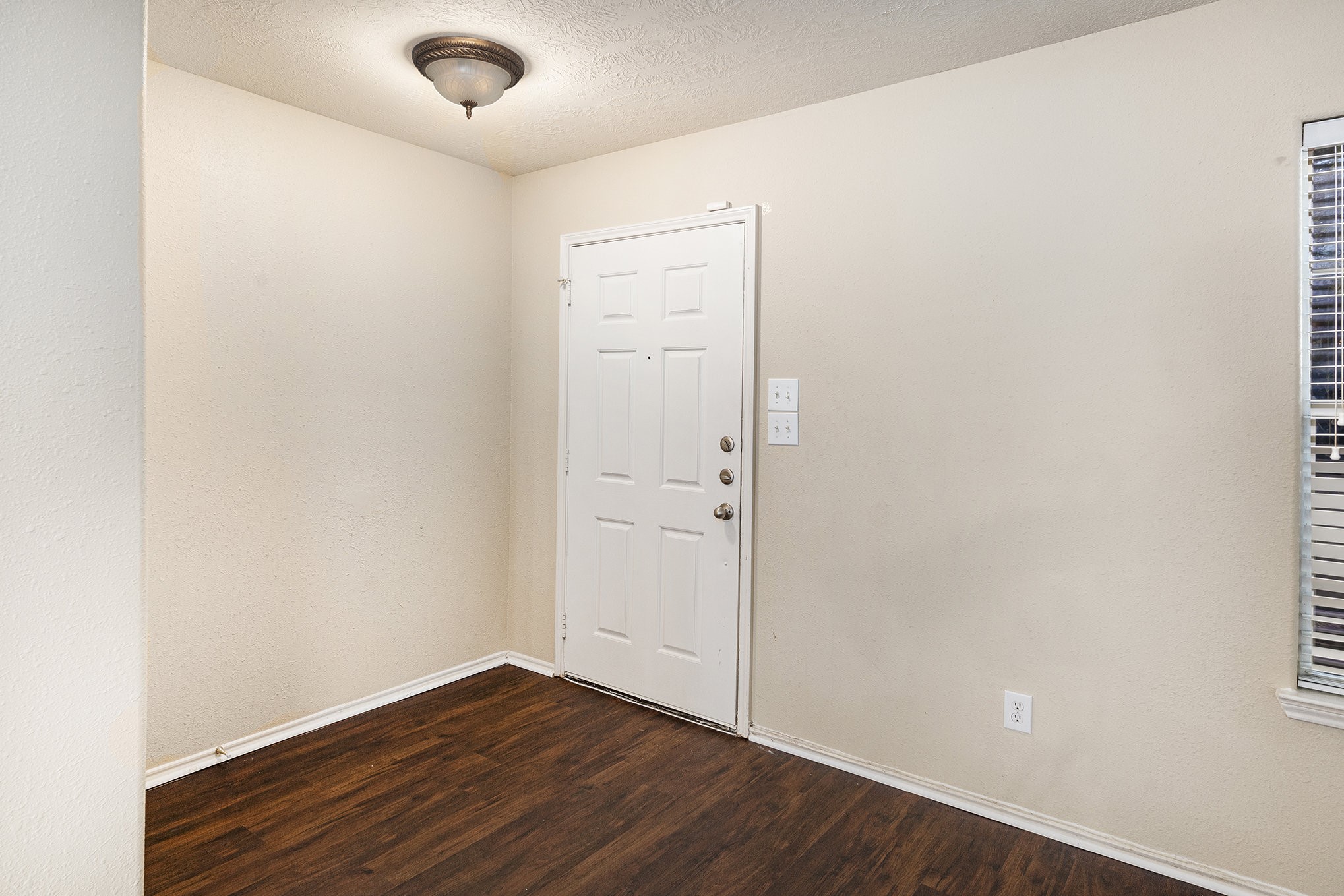 18227 Thicket Grove Road Houston, TX 77084 - Photo 8 of 28 an empty room with wooden floor