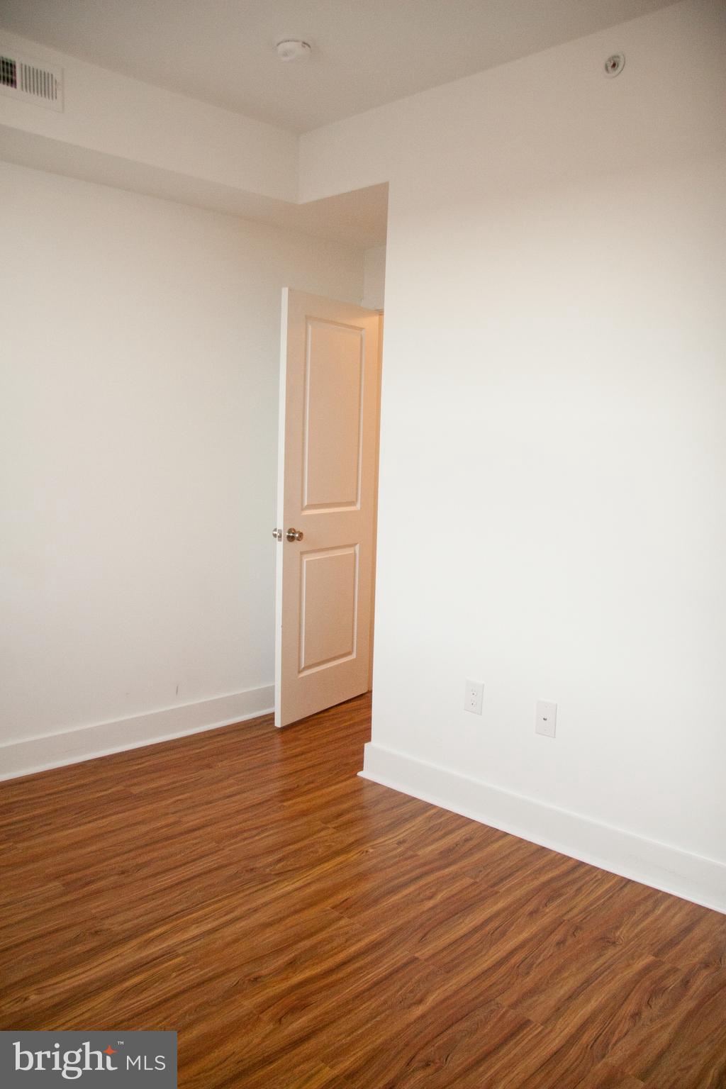 6040 Market Street, Unit 3 Philadelphia, PA 19139 - Photo 9 of 9 a view of an empty room with wooden floor