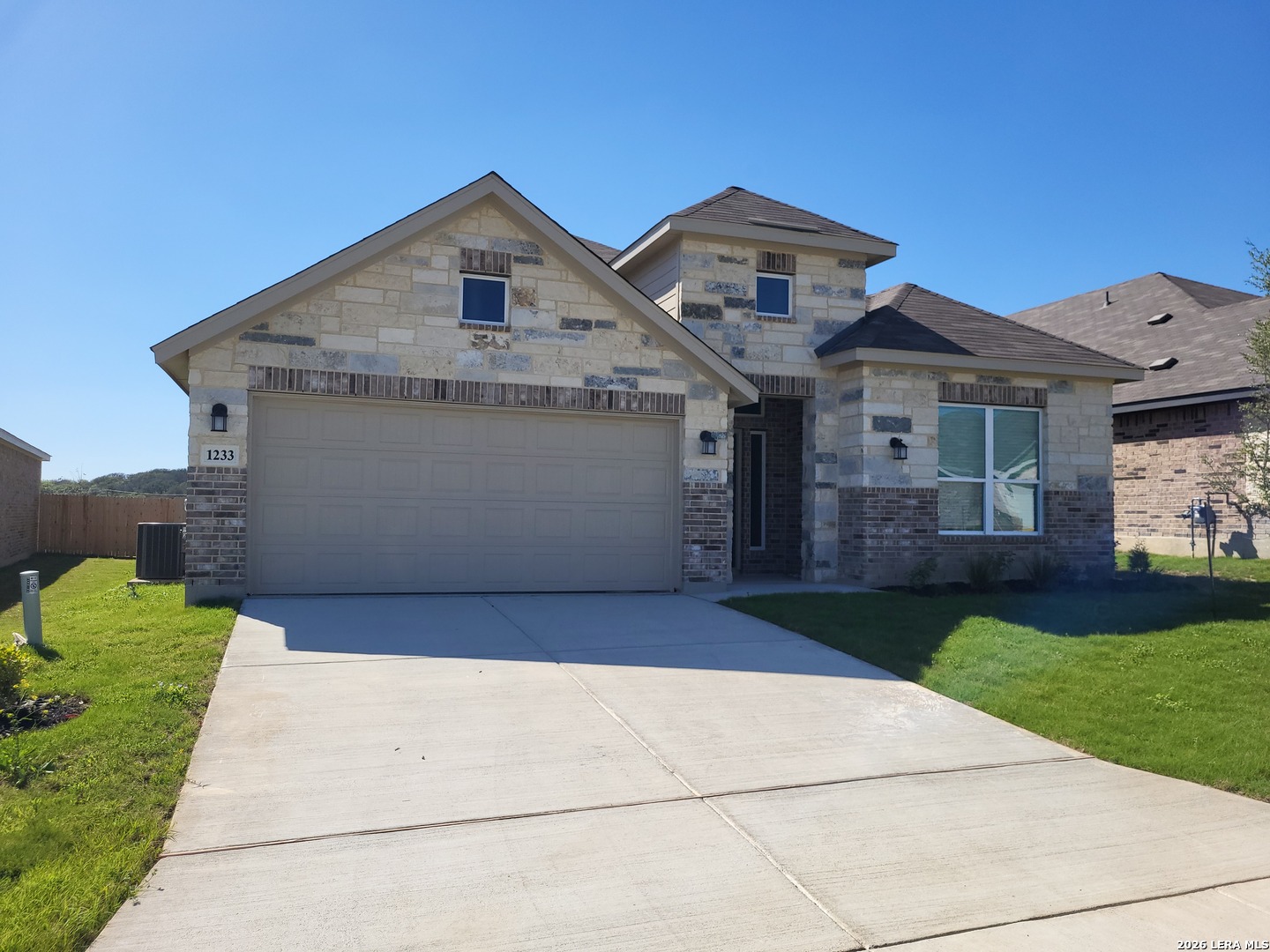 1233 Fox Wing Way New Braunfels, TX 78132 - Photo 1 of 19 a front view of a house with a yard