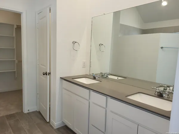 a view of an empty walk in closet