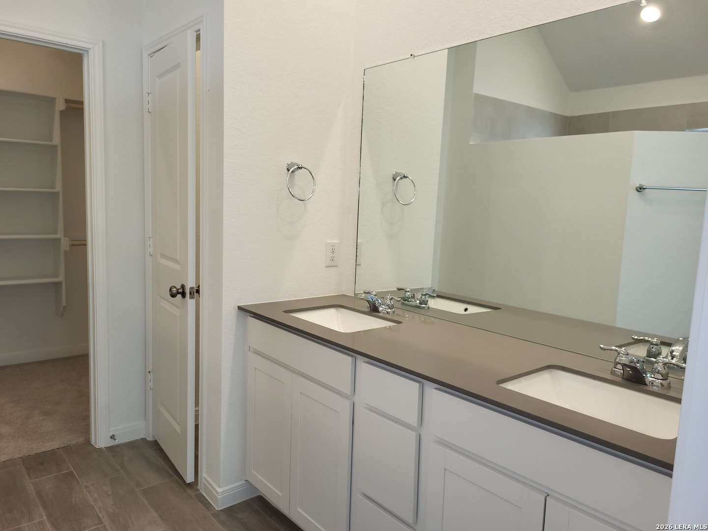 1233 Fox Wing Way New Braunfels, TX 78132 - Photo 13 of 19 a bathroom with a sink and a mirror