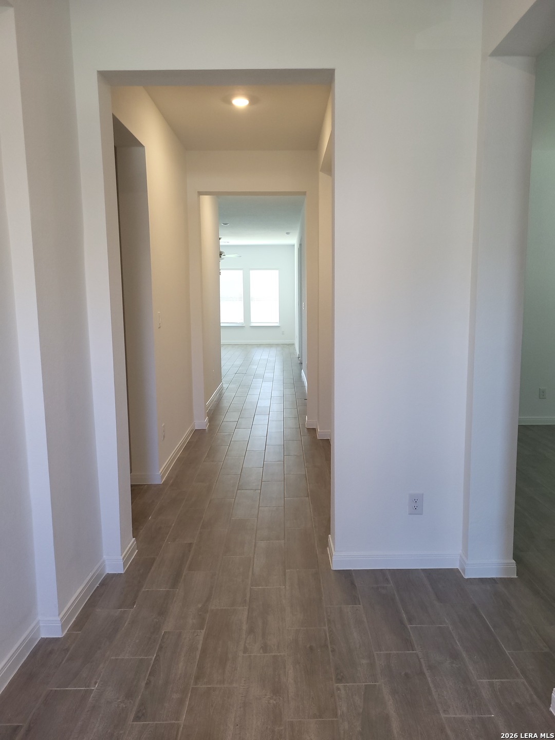 1233 Fox Wing Way New Braunfels, TX 78132 - Photo 3 of 19 a view of a hallway with wooden floor