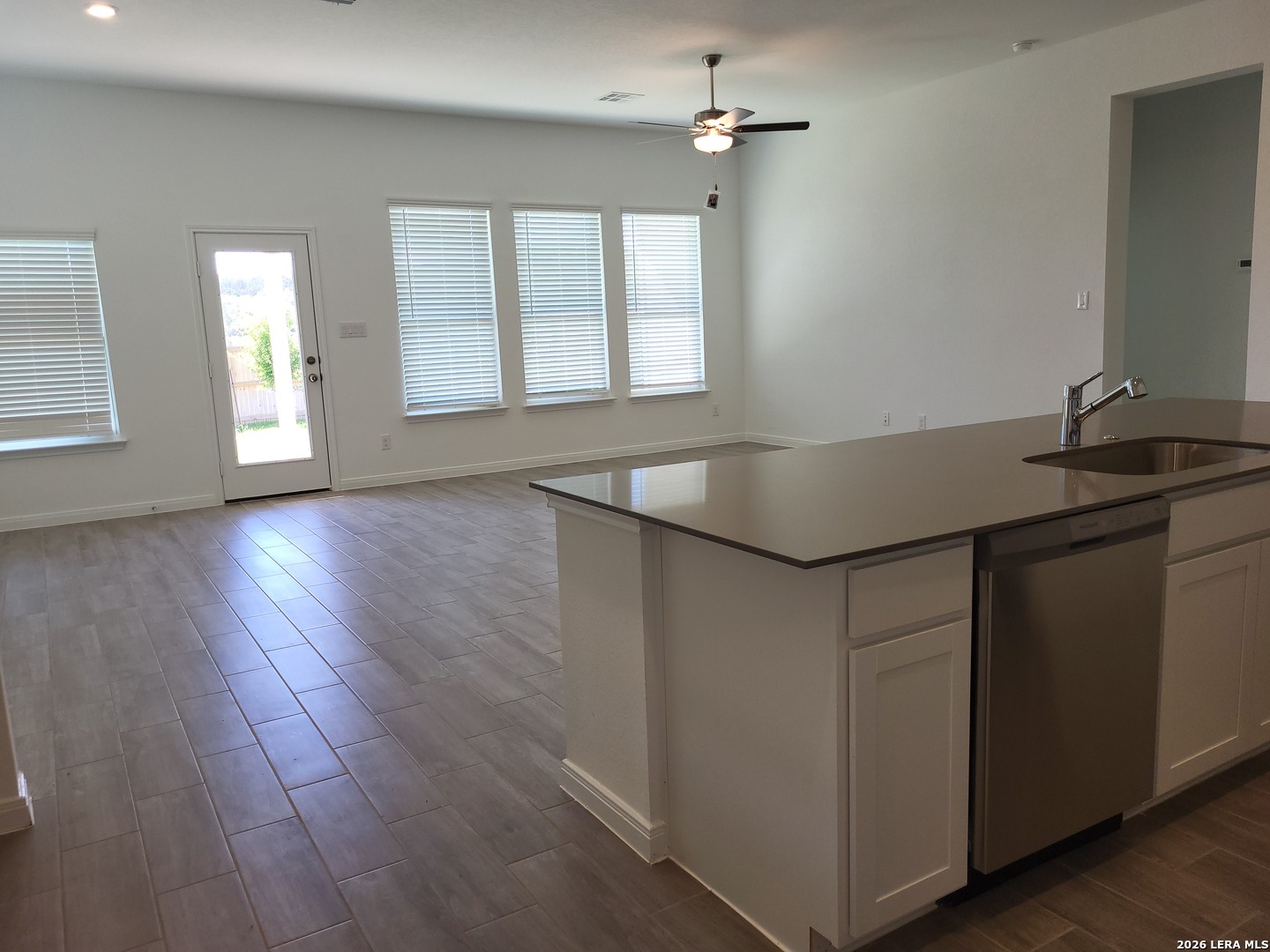1233 Fox Wing Way New Braunfels, TX 78132 - Photo 8 of 19 a kitchen with a sink cabinets and wooden floor