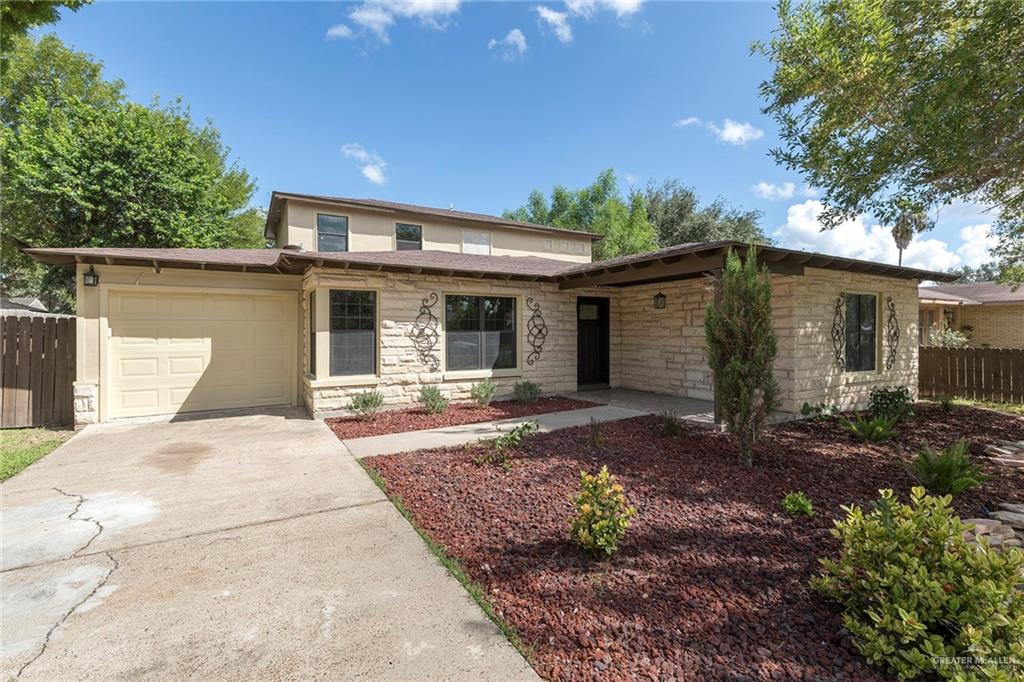 1312 North 5th Street McAllen, TX 78501 - Photo 2 of 25 A spacious front garage provides convenience and functionality for everyday living.