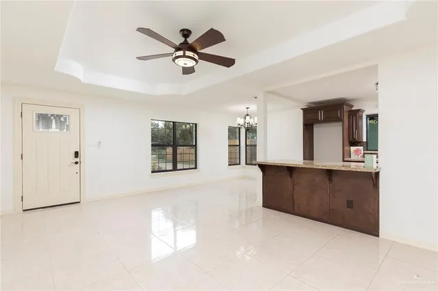 a view of a kitchen with a sink and cabinet