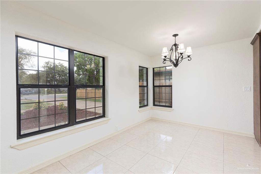 1312 North 5th Street McAllen, TX 78501 - Photo 7 of 25 Great front yard view just off the kitchen and living area. Could be additional living space!