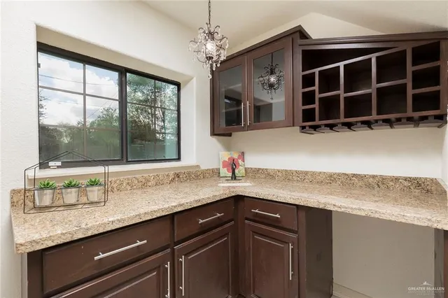 a view of a livingroom with a ceiling fan and window