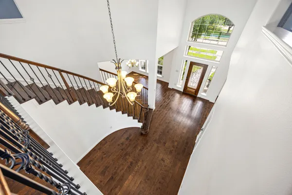 a view of a livingroom with furniture and staircase