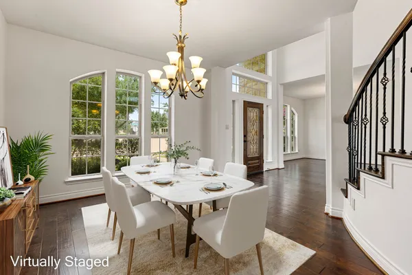 a view of a dining room with furniture window and wooden floor