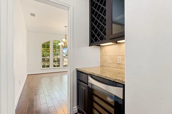 front view of a kitchen counter space a stove and a microwave