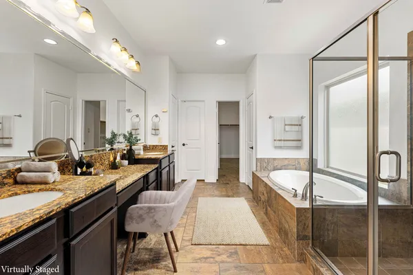 a dining hall with stainless steel appliances granite countertop a stove and a sink