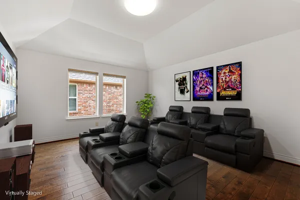 a living room with furniture window and wooden floor