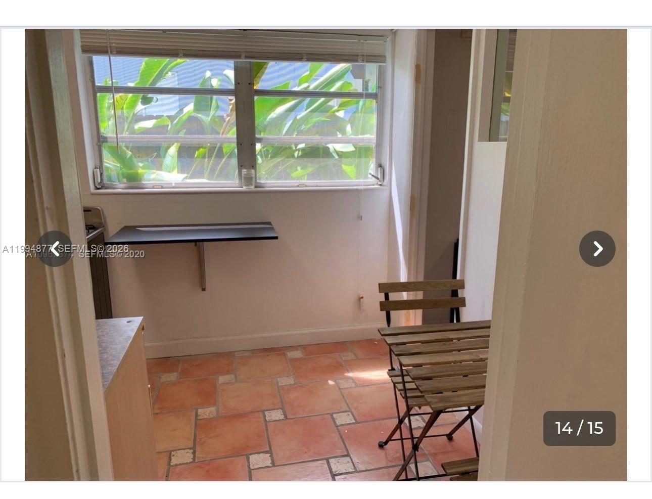 4230 Southwest 11th Street Miami, FL 33134 - Photo 5 of 8 a view of a room with a window and wooden floor