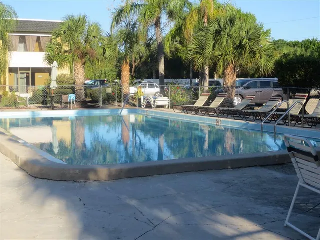 a view of a swimming pool with a patio