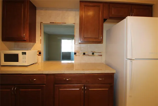 a view of a kitchen with a sink