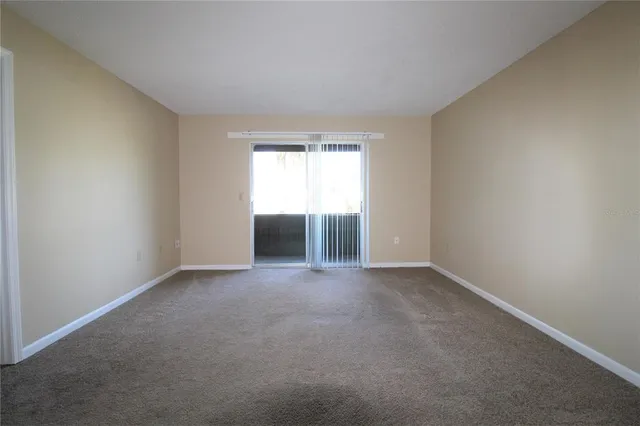an empty room with a empty space and window