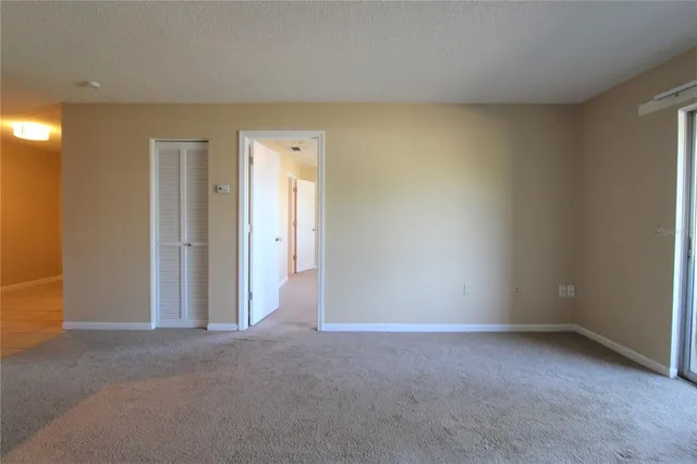 an empty room with closet area