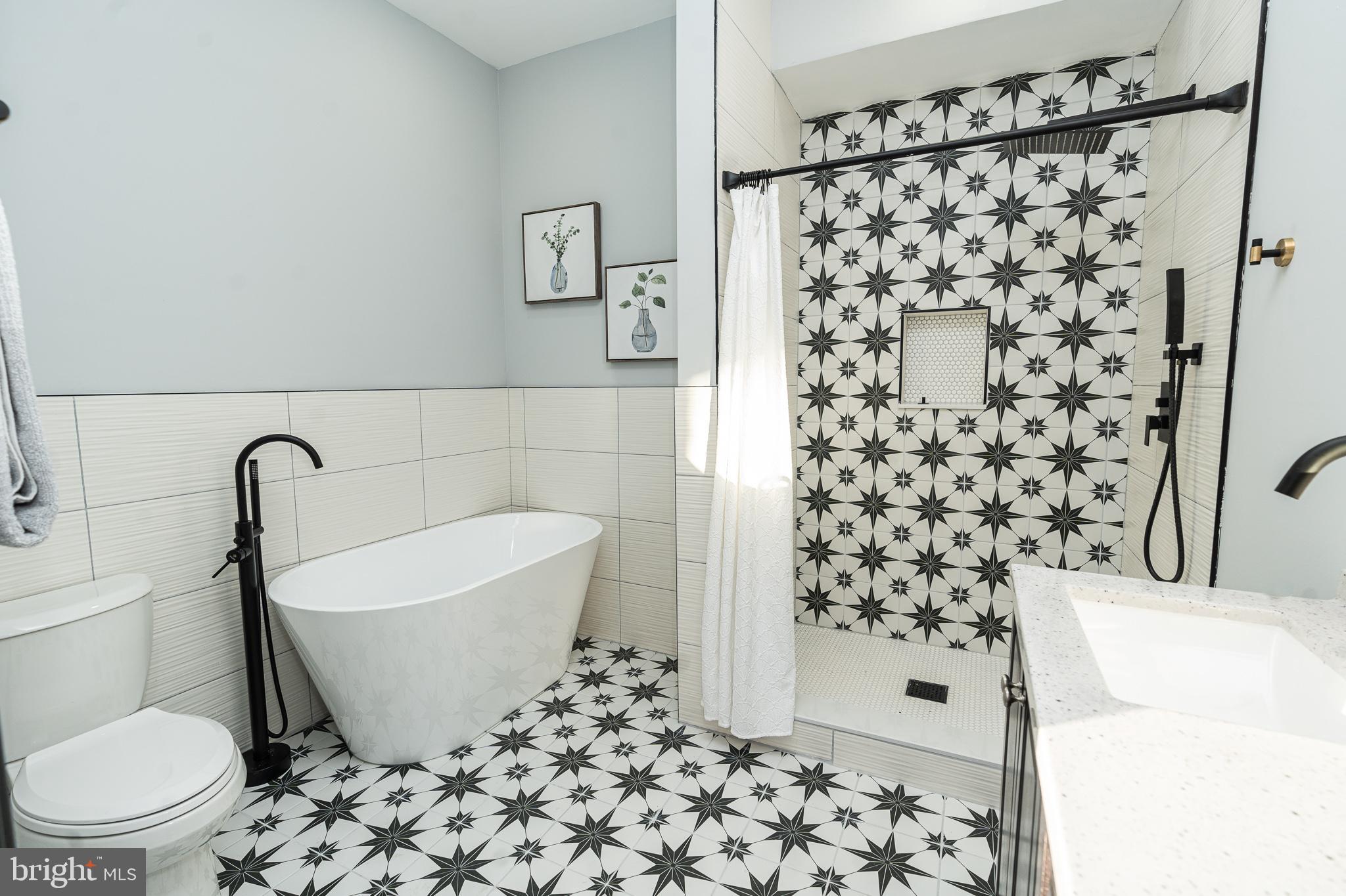 3910 Chatham Road Baltimore, MD 21207 - Photo 25 of 52 a bath room with a toilet and a shower