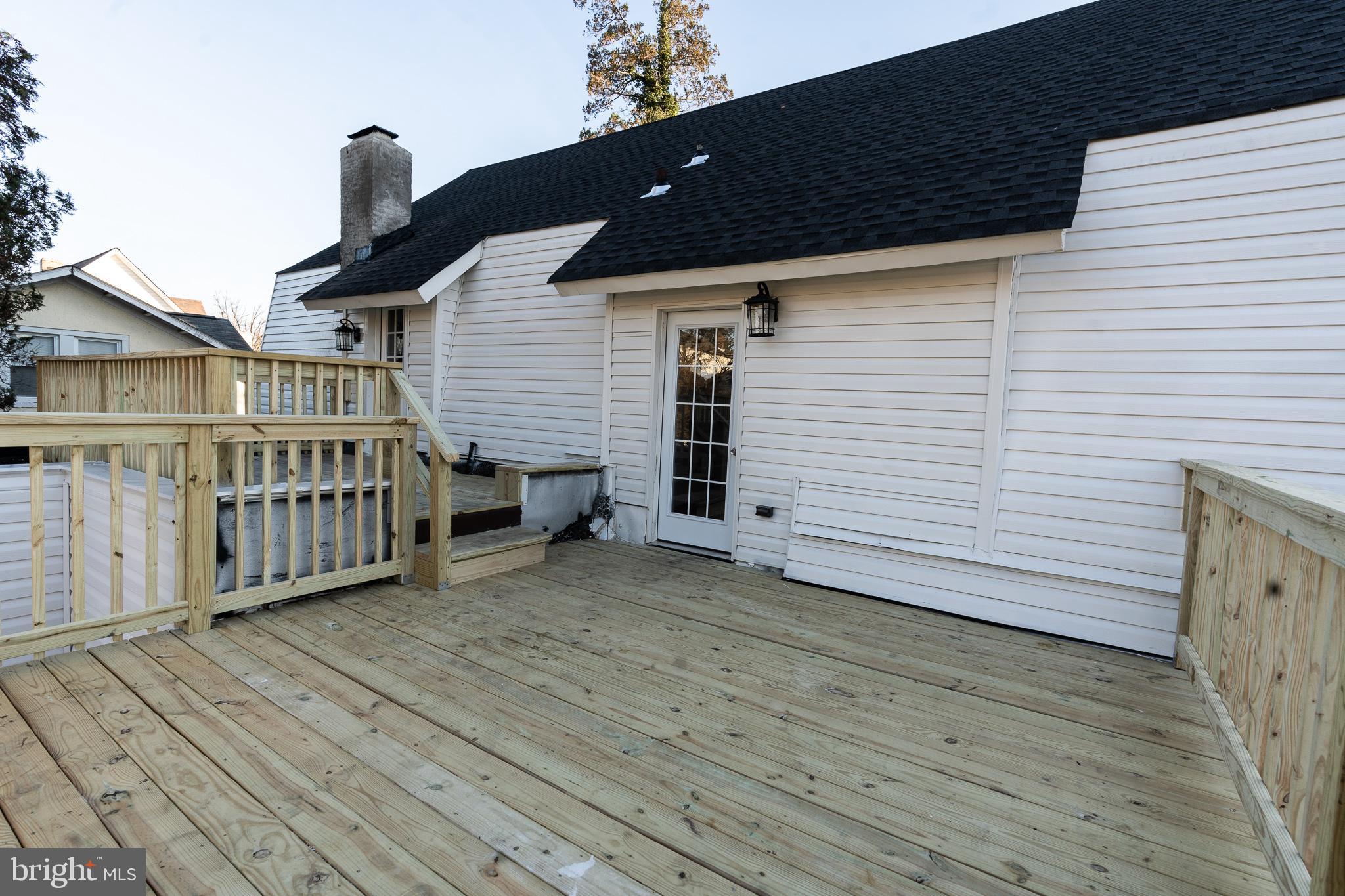 3910 Chatham Road Baltimore, MD 21207 - Photo 26 of 52 a view of a house with wooden deck