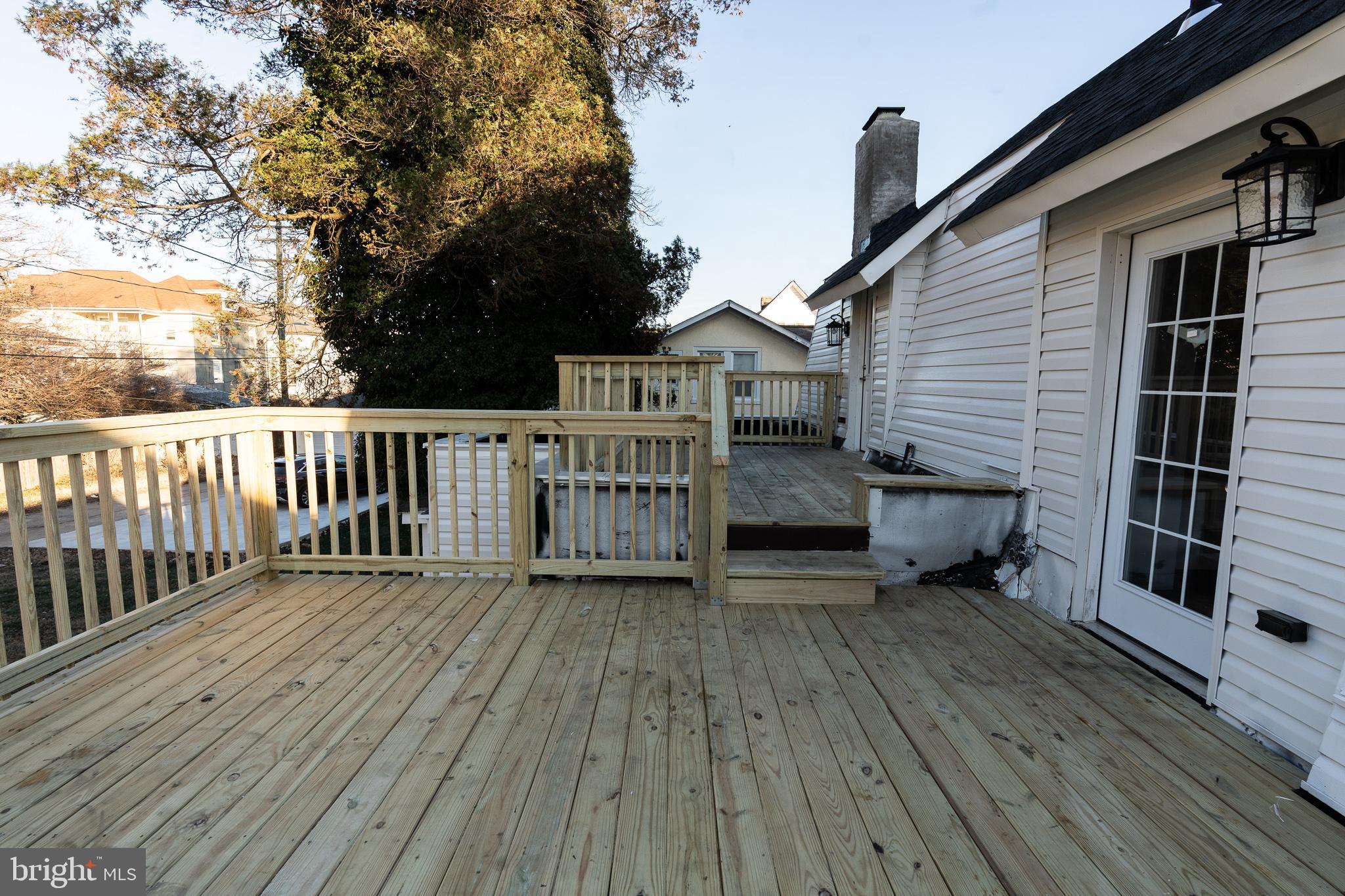 3910 Chatham Road Baltimore, MD 21207 - Photo 27 of 52 a view of a house with deck and wooden floor