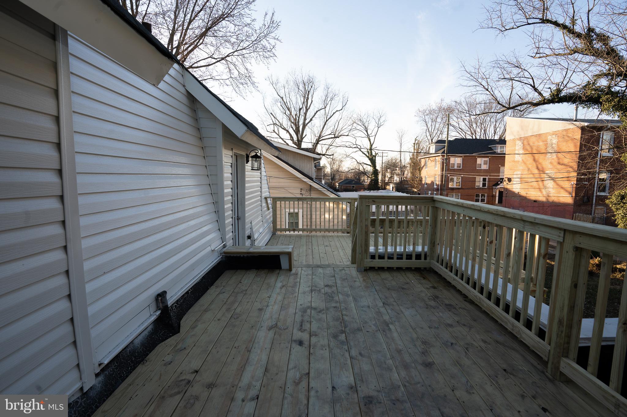 3910 Chatham Road Baltimore, MD 21207 - Photo 29 of 52 a view of a house with a deck