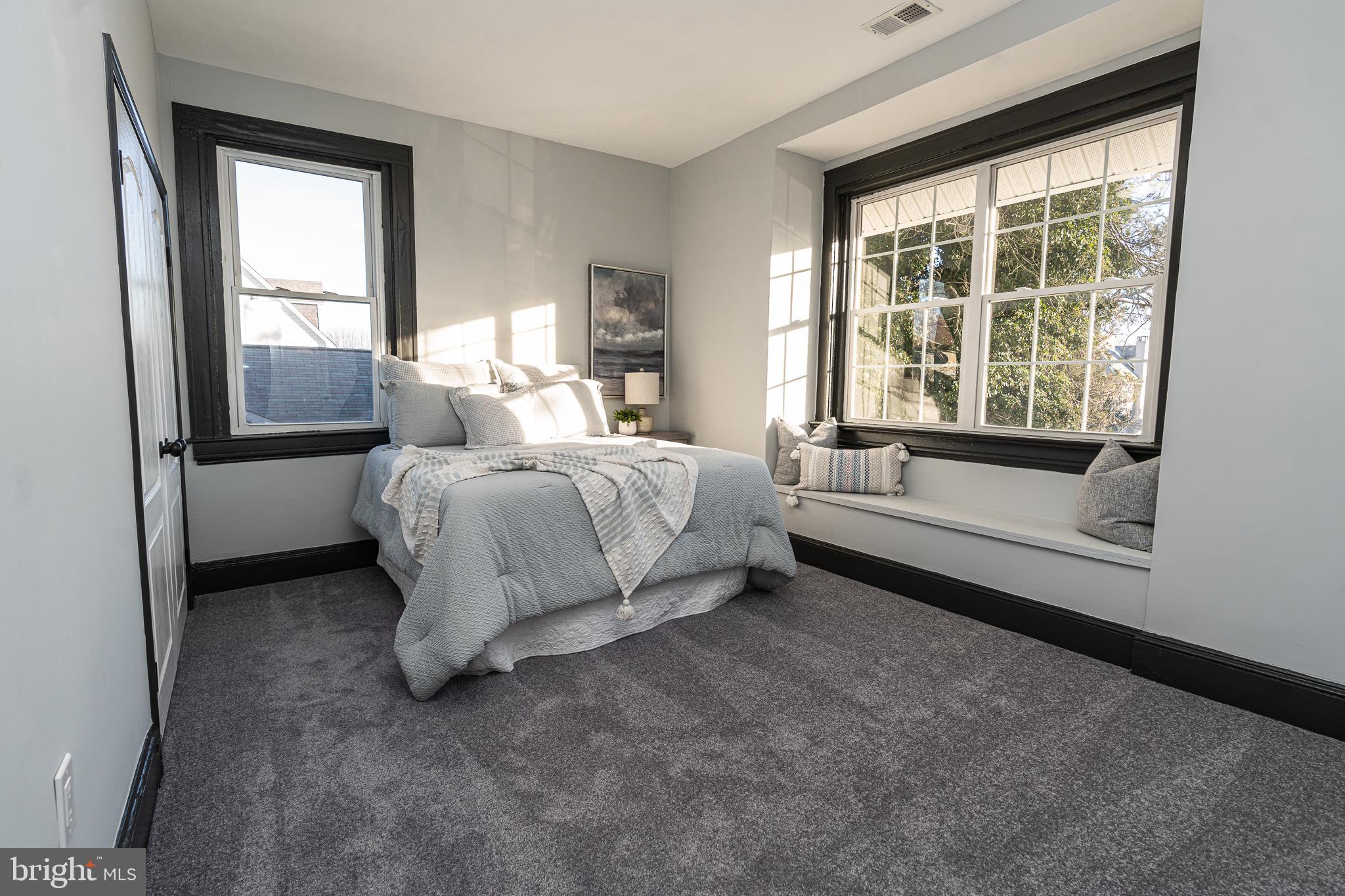 3910 Chatham Road Baltimore, MD 21207 - Photo 34 of 52 a bedroom with a bed and a window