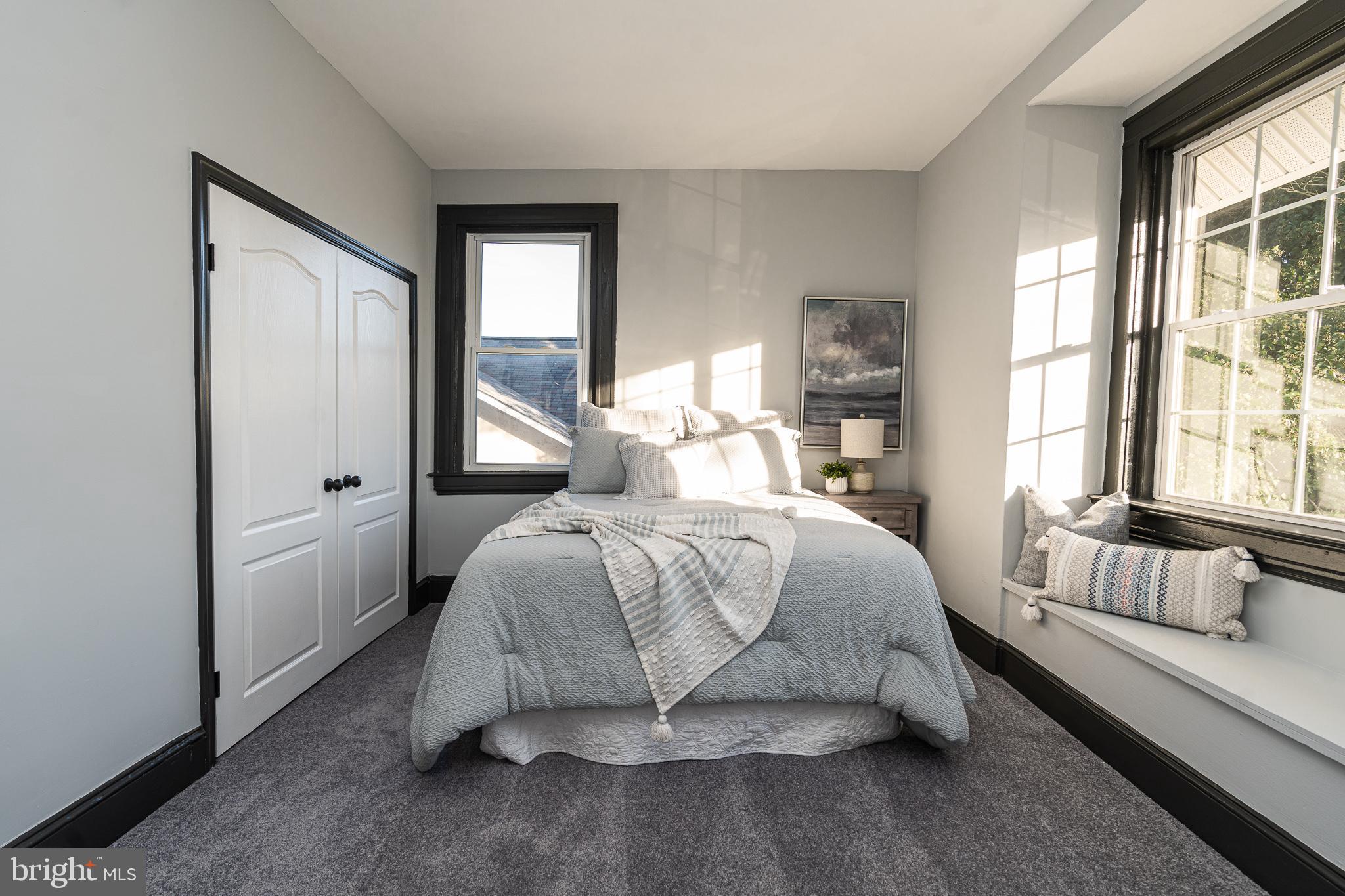 3910 Chatham Road Baltimore, MD 21207 - Photo 35 of 52 a bedroom with a bed and a window